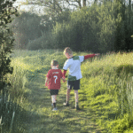Two brothers playing together, highlighting sibling support and the experience of invisible disabilities