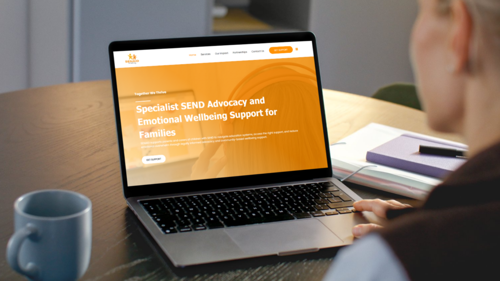 Someone looking at the SENDaid website on a laptop.